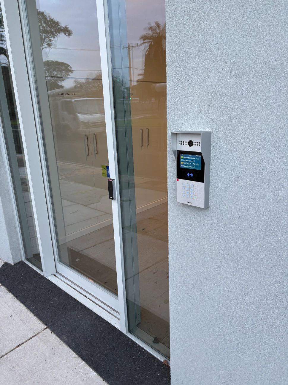 Securelec access control intercom installed beside a commercial entry